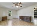 Bright bedroom with laminate flooring, a ceiling fan, and natural light from the window at 106 Argyle Ct, Garner, NC 27529