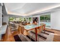 Bright dining area with an updated table and views of the backyard pool and patio at 1111 Sourwood Cir, Chapel Hill, NC 27517