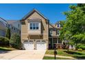 Charming two-story home with a two-car garage and a well-manicured front yard at 113 Ruskin Dr, Chapel Hill, NC 27516