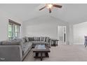 Spacious living room featuring neutral paint colors, a ceiling fan and carpet at 124 Willa Chase Ct, Benson, NC 27504