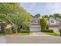 Charming two-story home with a two-car garage, manicured lawn and inviting curb appeal at 216 Beringer Pl, Chapel Hill, NC 27516