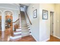 Welcoming foyer with hardwood floors and a staircase leading to the upper level at 216 Beringer Pl, Chapel Hill, NC 27516