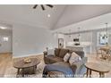 Spacious living area with hardwood floors flowing into a modern kitchen, perfect for entertaining at 249 Rawhide Dr, Louisburg, NC 27549