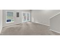 Spacious, carpeted bonus room with French doors and neutral tones at 2705 Wyntercrest Ln, Durham, NC 27713