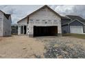 New home construction shows the framing and garage opening prior to final finishing at 2874 Quarry Rd # 165, Rolesville, NC 27571