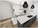 Bright kitchen and dining area with island seating, modern lighting, and large windows at 2911 Alyssa Ct, Raleigh, NC 27604
