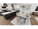 Bright dining area with modern chandelier, seating for six, and access to the kitchen island at 2915 Alyssa Ct, Raleigh, NC 27604