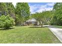 Spacious, well-kept lawn enhances this charming brick home's curb appeal at 3404 Apple Meadow Dr, Fuquay Varina, NC 27526