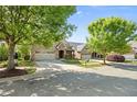 A wide street view of brick homes showcasing well-kept lawns and landscaping, conveying a friendly neighborhood at 4116 Argyle Trl, Burlington, NC 27215