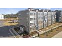 A high angle view of new townhome construction with sidewalks and professional landscaping at 412 Gaston Park Ln # 200, Wake Forest, NC 27587