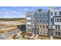 Stunning exterior elevation of newly constructed townhomes with modern design elements at 414 Gaston Park Ln # 200, Wake Forest, NC 27587