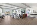 Spacious living room with hardwood floors, modern decor, and abundant natural light at 414 Gaston Park Ln # 200, Wake Forest, NC 27587