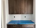 Unfinished kitchen features abundant cabinet storage and white counter top space at 4317 Emeline Way # 12, Fuquay Varina, NC 27526