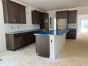 Spacious kitchen includes ample counter space, abundant cabinet storage, and a large island at 4317 Emeline Way # 12, Fuquay Varina, NC 27526