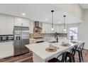 Updated kitchen with stainless steel appliances, modern backsplash and a large island at 4902 Cedar Glen Dr, Durham, NC 27713