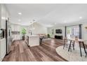 Open concept living area offers seamless flow, modern finishes, and a welcoming atmosphere for entertaining at 4902 Cedar Glen Dr, Durham, NC 27713