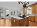 Bright and airy kitchen featuring a center island, stainless steel appliances, and lots of natural light at 5619 Bennettwood Ct, Raleigh, NC 27612