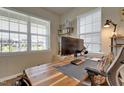 Bright office with a large desk, ergonomic chair, and natural light perfect for work or study at 636 Ginger Mint Cir, Knightdale, NC 27545