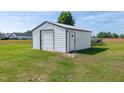Spacious metal building offers ample storage space and complements the surrounding landscape at 640 Short Journey Rd, Smithfield, NC 27577