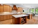 Spacious kitchen featuring wooden cabinets, a center island, and stainless steel appliances for modern cooking at 77 Ruffed Grouse, Chapel Hill, NC 27517