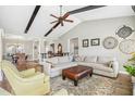 Spacious living area features vaulted ceilings, wood-look flooring, and comfortable seating arrangement at 17 Kaki Ct, Selma, NC 27576