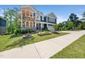 A two-story home with a well-maintained lawn and landscaping at 1813 Lost Creek Ct, Apex, NC 27539