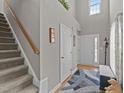 Welcoming entryway with staircase, neutral paint, and an open, airy feel with natural light at 228 Honeywell Way, Fuquay Varina, NC 27526