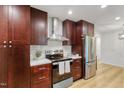 Updated kitchen featuring stainless steel appliances and custom cabinets at 2311 Wintergreen Pl, Durham, NC 27707