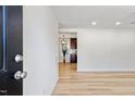 Bright, freshly painted living room showcasing the hardwood floors and open floor plan at 2311 Wintergreen Pl, Durham, NC 27707