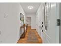 Bright entryway featuring hardwood floors, white walls, and stylish console table at 2508 Sevier St, Durham, NC 27705