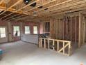 A house under construction with exposed framing and a concrete floor at 2868 Quarry Rd # 167, Rolesville, NC 27571