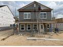 Exterior view of a two-story home under construction, showing workers and the house frame at 2868 Quarry Rd # 167, Rolesville, NC 27571