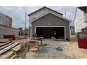 An unfinished garage showcasing the framing and gravel flooring at 2868 Quarry Rd # 167, Rolesville, NC 27571