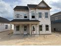 Two-story home under construction with visible framing and wrapped in branded weather-resistant material at 2872 Quarry Rd # 166, Rolesville, NC 27571