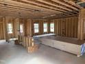 Interior view of a home under construction showing the framing with visible studs and door and window openings at 2872 Quarry Rd # 166, Rolesville, NC 27571