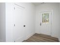 Bright entryway featuring beautiful floors, closet and a white door with glass pane at 3258 Yorkshire Cir, Sanford, NC 27332