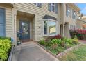 Inviting entrance with landscaped garden and a bay window enhancing curb appeal at 35 Stonewall Way, Durham, NC 27704