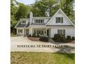 Charming two-story home with a manicured front yard and a concrete driveway at 3504 Rock Creek Dr, Raleigh, NC 27609