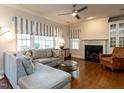 Bright living room with hardwood floors, fireplace, and modern decor at 3504 Rock Creek Dr, Raleigh, NC 27609