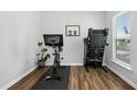 Well-lit home gym featuring a stationary bike and treadmill, perfect for staying active at 5009 Megara, Raleigh, NC 27603