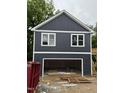 New construction featuring a two-story garage with ample space for vehicles and storage at 618 Price Ave, Durham, NC 27701