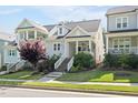 Charming home with landscaped front yard, welcoming front porch, and inviting curb appeal at 706 Great Ridge Pkwy, Chapel Hill, NC 27516