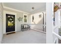 Charming front porch with bench, decorative wreath, and inviting ambiance at 706 Great Ridge Pkwy, Chapel Hill, NC 27516