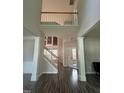 Spacious foyer featuring hardwood floors, soaring ceilings, and an elegant staircase at 110 Bristolwood Cir, Morrisville, NC 27560