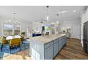 Open-concept kitchen with a large island, seamlessly flowing into the living and dining areas for easy entertaining at 110 Deacon Ridge Ln, Youngsville, NC 27596