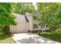 Beautiful home featuring a two-car garage and a well-maintained lawn, surrounded by mature trees at 110 Ferris Wheel Ct, Cary, NC 27513