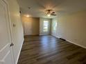 Spacious living room with luxury vinyl plank flooring, offering a bright and airy atmosphere at 1208 Olympic Dr, Mebane, NC 27302