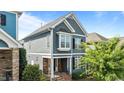 Lovely two-story home featuring a covered front porch and inviting curb appeal at 1209 Harp St, Raleigh, NC 27604