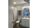 Bathroom with white shower curtain, mirror and vanity with sink and toilet at 130 S Estes Dr # C-5, Chapel Hill, NC 27514