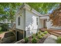 This home features a convenient drive-under garage and beautifully landscaped yard with mature trees at 1316 Glenwood Ave, Raleigh, NC 27605